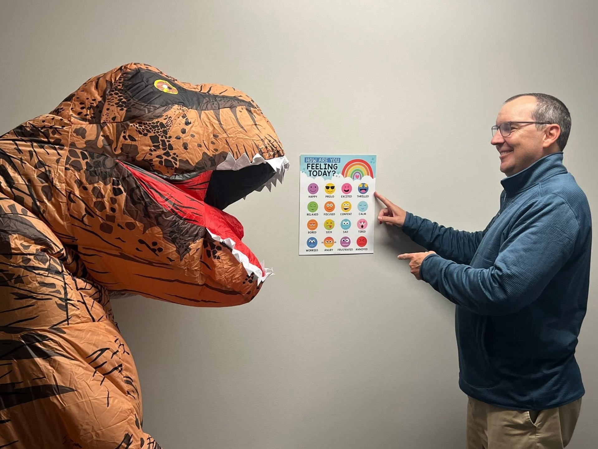 KCFC therapist teaching a dinosaur about feelings